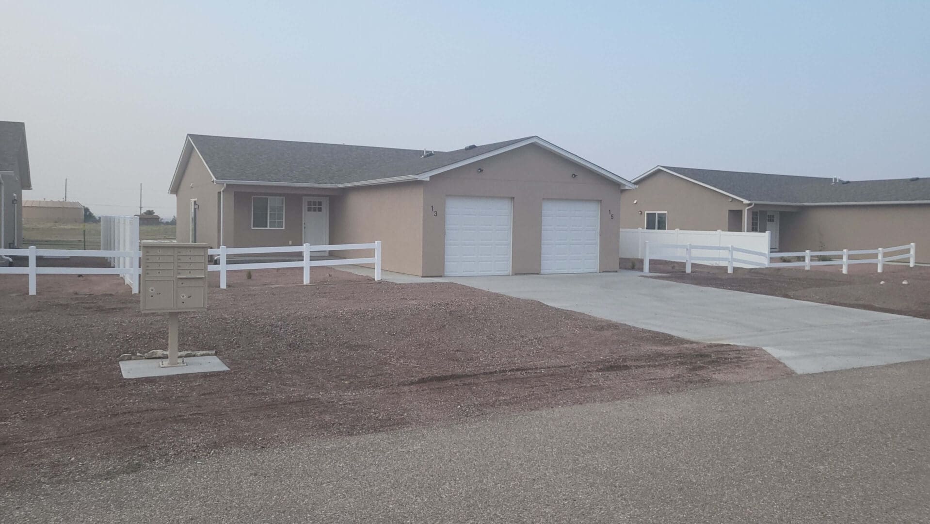 Single-story house with two car garage.
